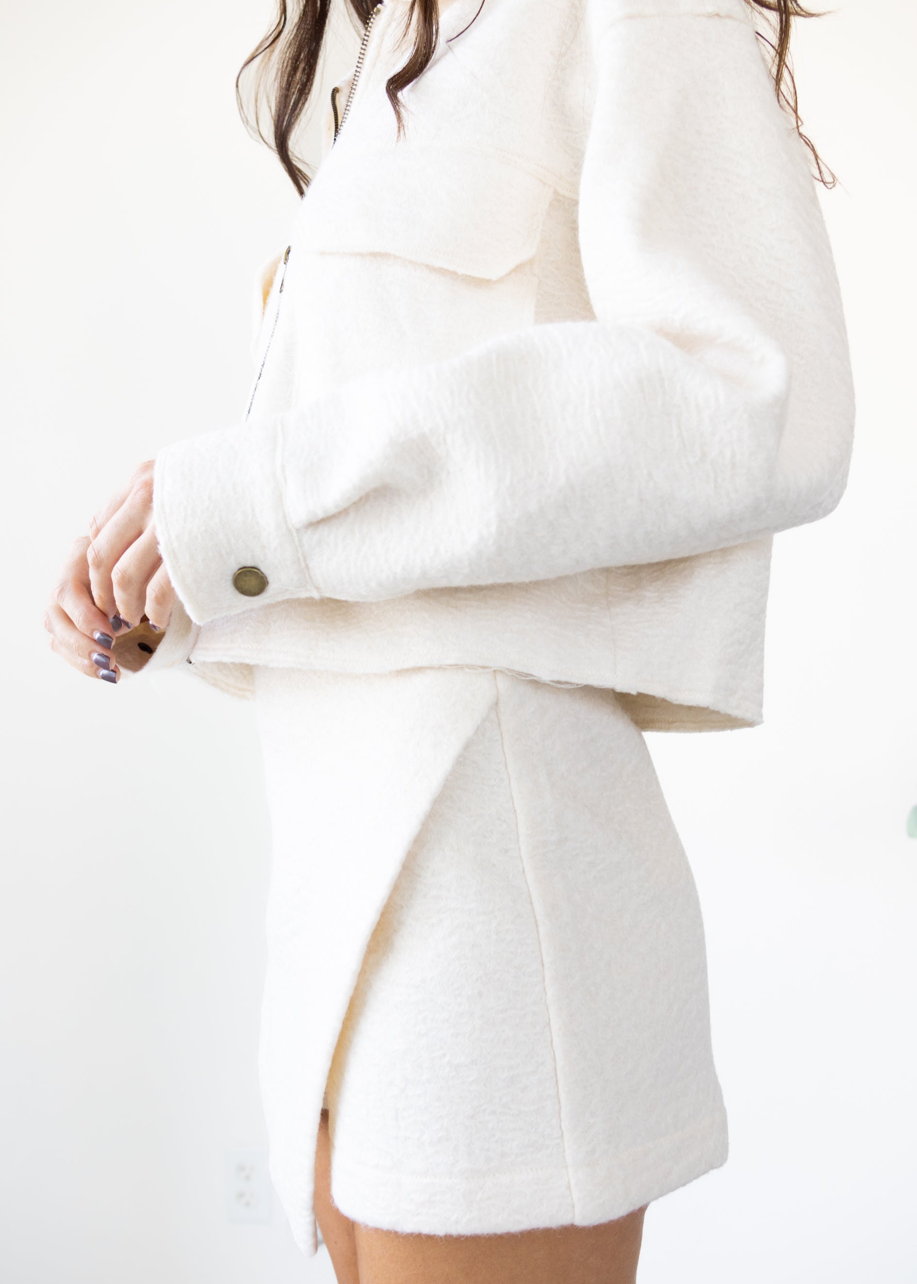 White coat with a high collar and buttons on a white background