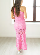 woman wearing long pink dress