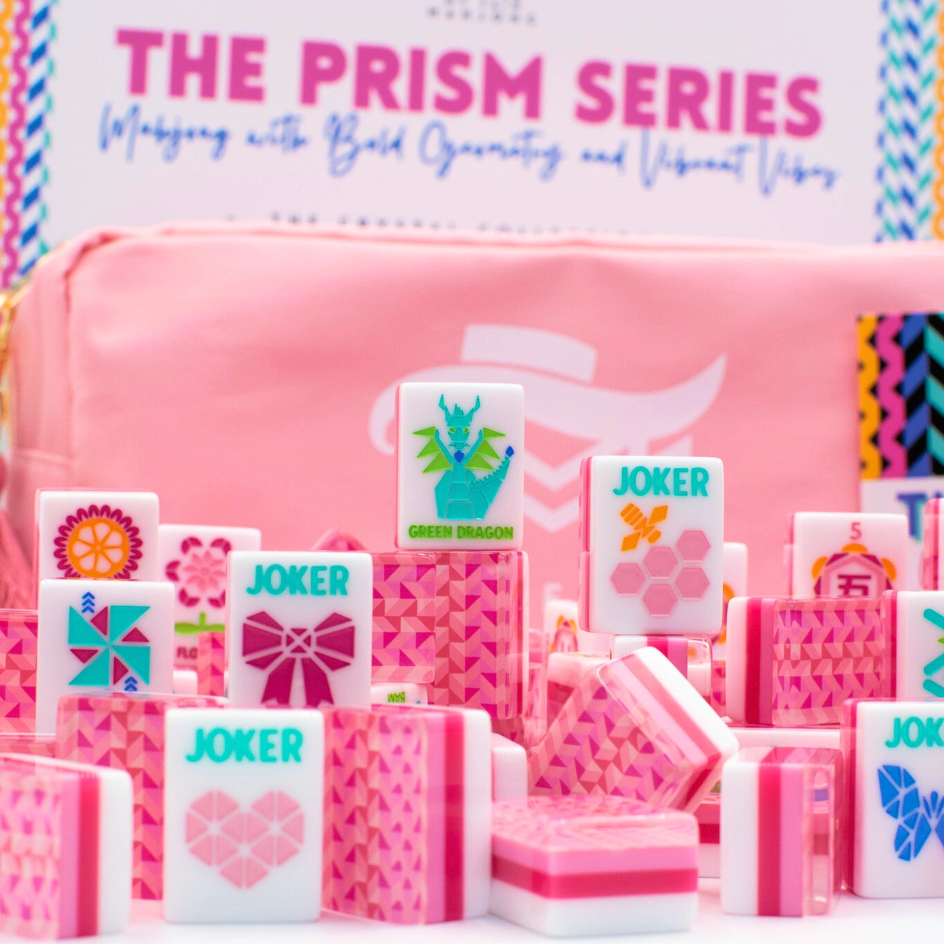 Pink mahjong set with 'The Prism Series' branding on a colorful background