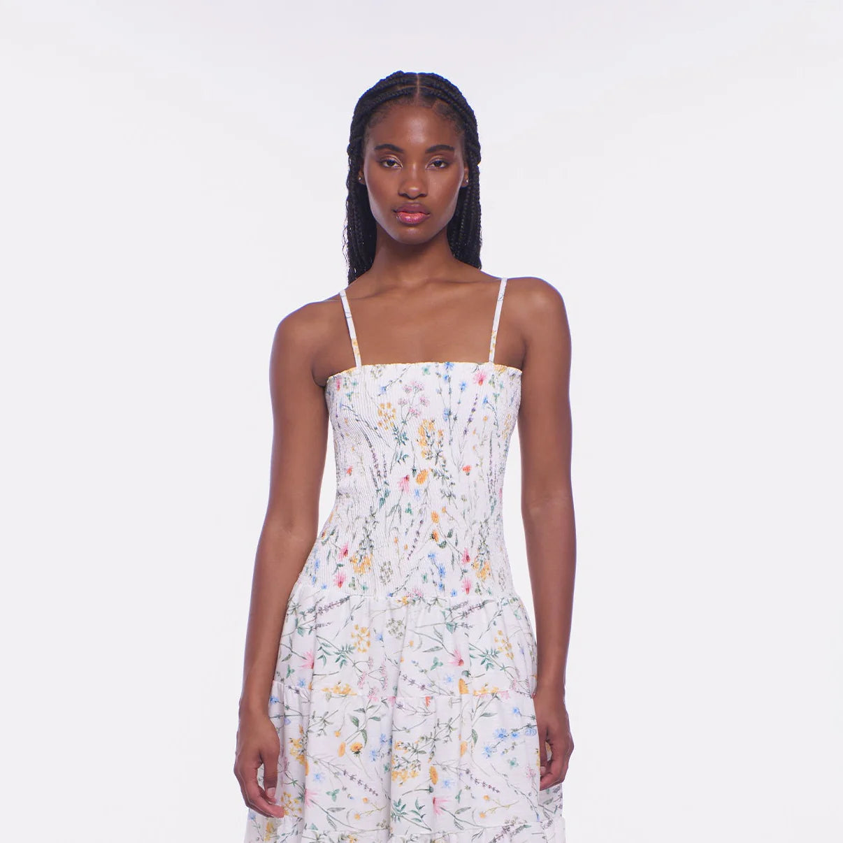 Woman wearing a floral dress on a white background