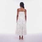 Woman wearing a floral dress on a white background