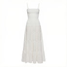 White dress with a tiered skirt on a white background