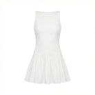 White pleated dress on a white background