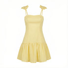 Yellow dress with thin straps on a white background