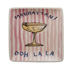 square ceramic plates with cocktail-themed designs and text on a white background