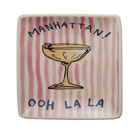 square ceramic plates with cocktail-themed designs and text on a white background