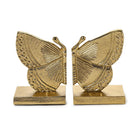 Gold butterfly bookends on a white background