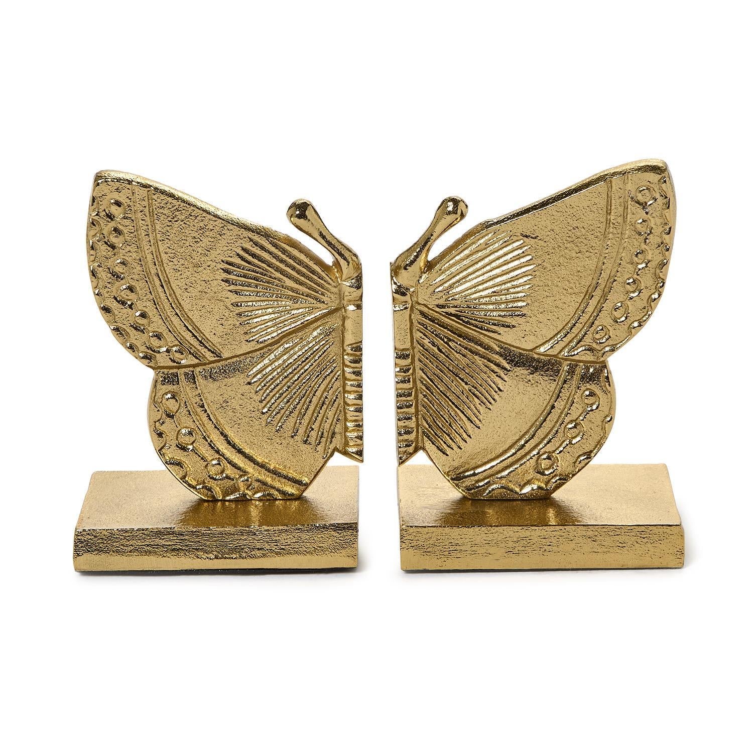 Gold butterfly bookends on a white background