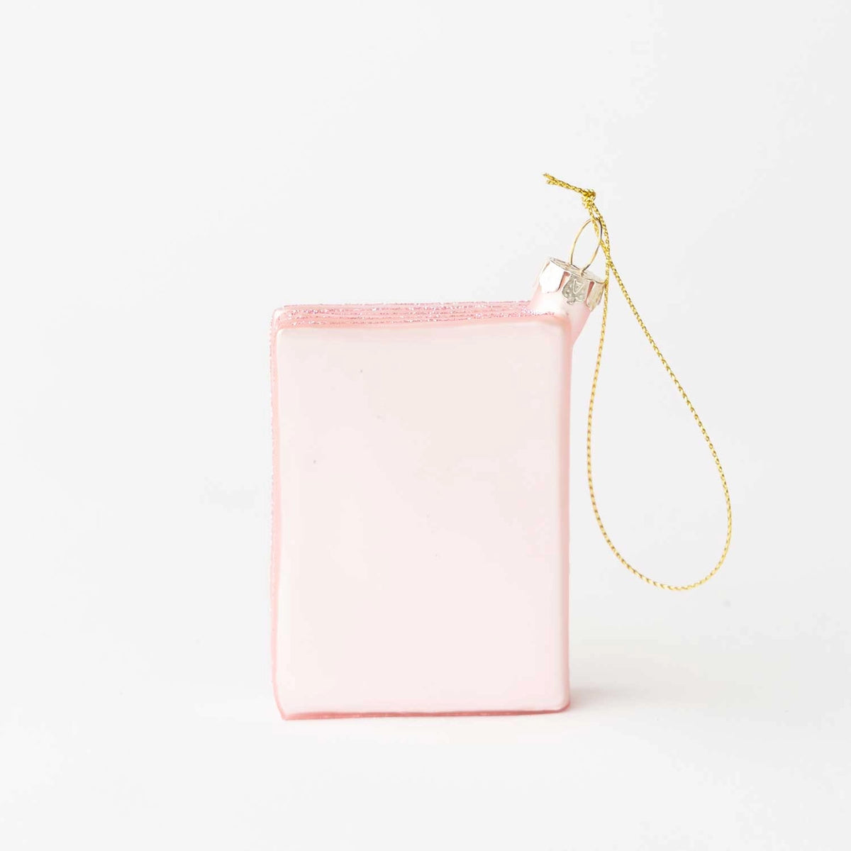 A small, rectangular light pink pouch or organizer with a gold-tone hanging chain strap, shown on a clean white background.