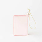 A small, rectangular light pink pouch or organizer with a gold-tone hanging chain strap, shown on a clean white background.