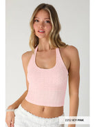 A woman modeling a light pink textured halter crop top against a plain light gray studio background. A small label in the bottom right reads '2252 ICY PINK'.