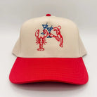 Beige and red cap with lobster and martini design on a white background