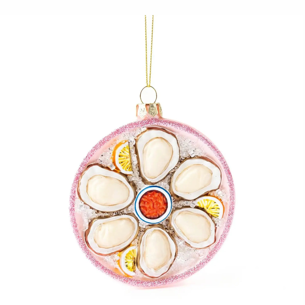 A round glass Christmas ornament styled like a platter of mussels on ice, featuring cream-colored mussel shells, yellow lemon slices, a red-orange center, and a glittery pink rim, hanging by a gold string.