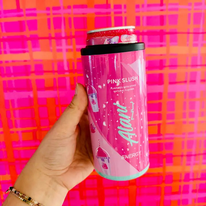 Pink energy drink can held by a hand against a colorful plaid background
