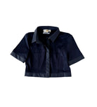 A cropped short-sleeve button-up shirt in dark navy blue, featuring contrast dark satin-like trim along the collar, cuffs, and hem, displayed against a solid white background.