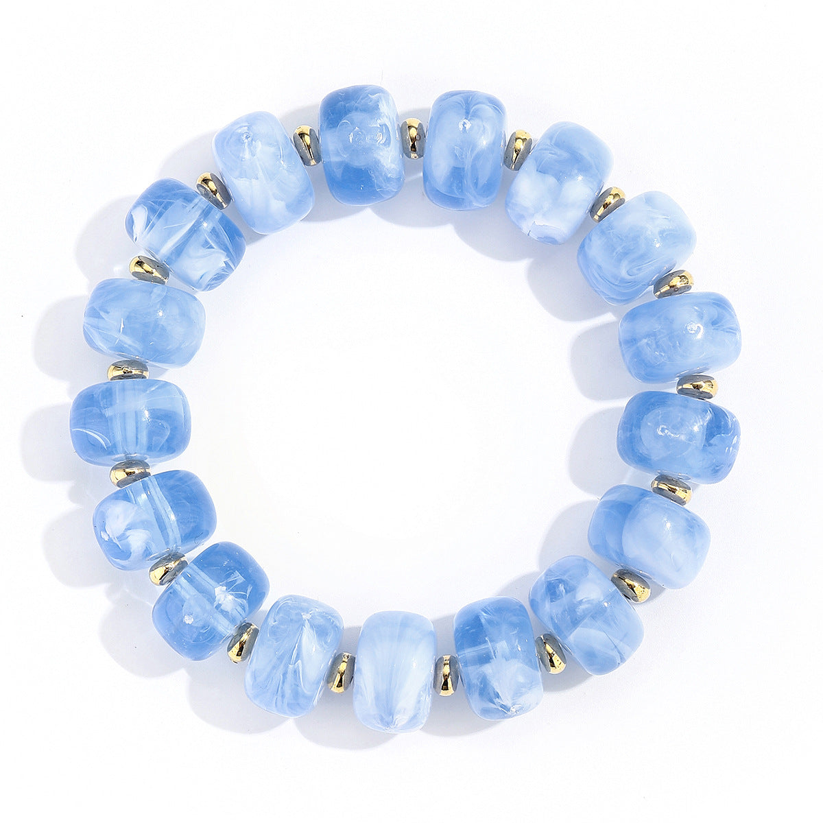 A beaded stretch bracelet made of light blue marbled beads separated by small metallic gold spacer rings, shown on a plain white background.