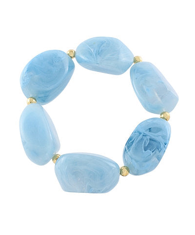 Blue stone bracelet with gold accents on a white background