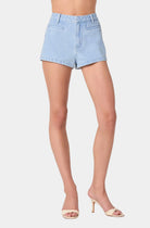 Light blue denim shorts worn by a person on a white background