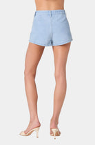 Light blue denim shorts worn by a person on a white background