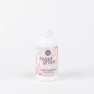 Bottle of Sweet Grace laundry detergent on a white background