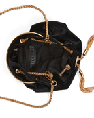 Black velvet bucket bag with gold-tone chain strap, circular metal frame, and tassel detail, shown from a top-down view on a white background. The brand name 'INITIATE' is visible on the interior label.