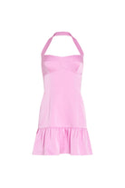 Pink halter neck dress on a white background