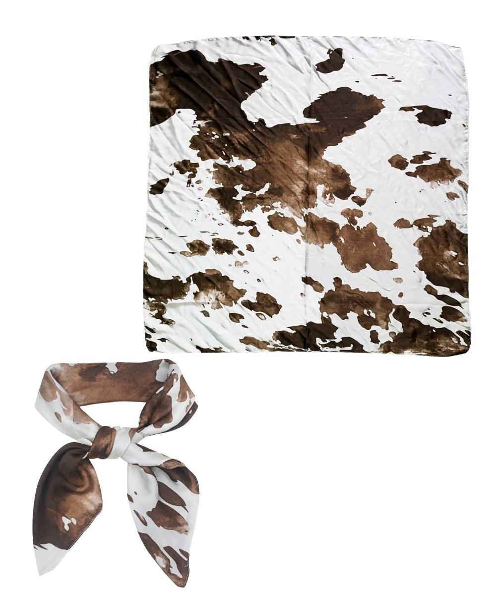 A square scarf with a brown and white cow print pattern, shown both flat and tied in a bow on a plain white background.