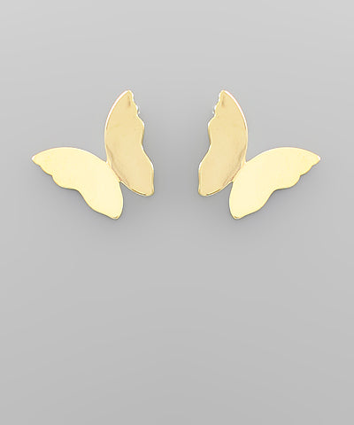 Gold butterfly-shaped earrings on a gray background