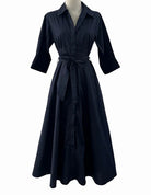 Black dress on a mannequin against a white background