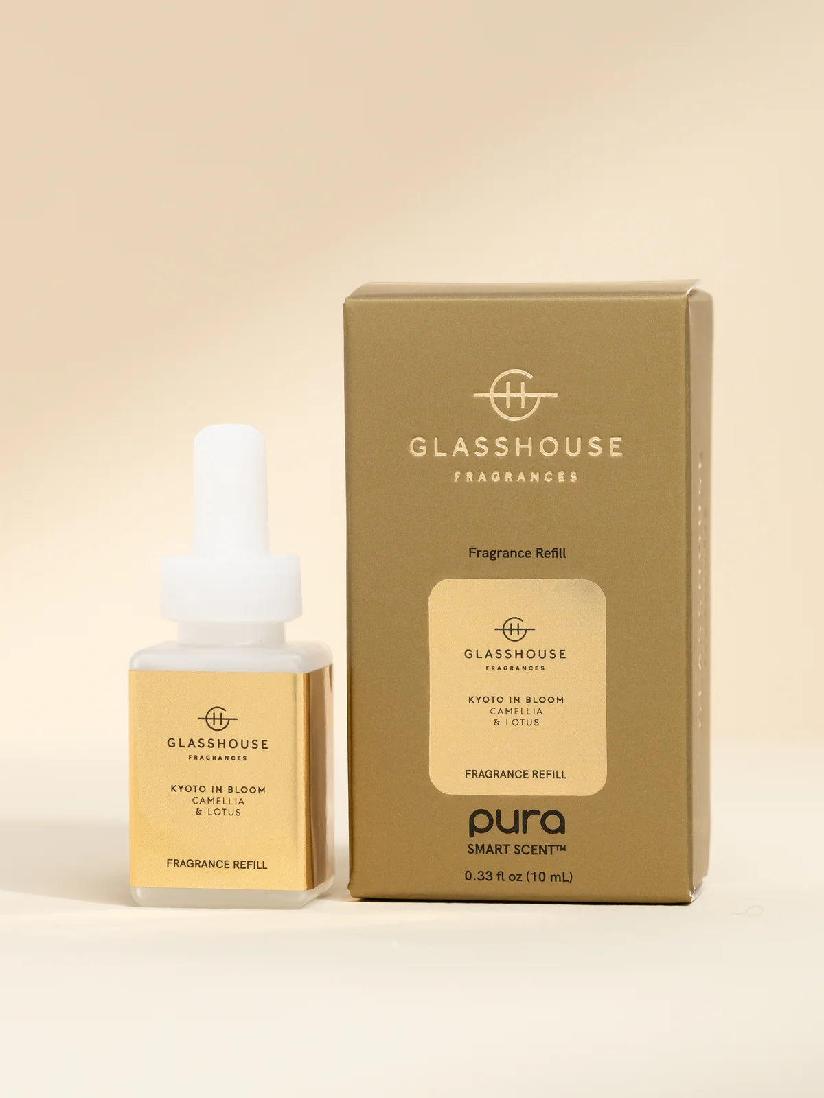 Glasshouse Fragrances Pura Smart Scent refill bottle and packaging on a beige background