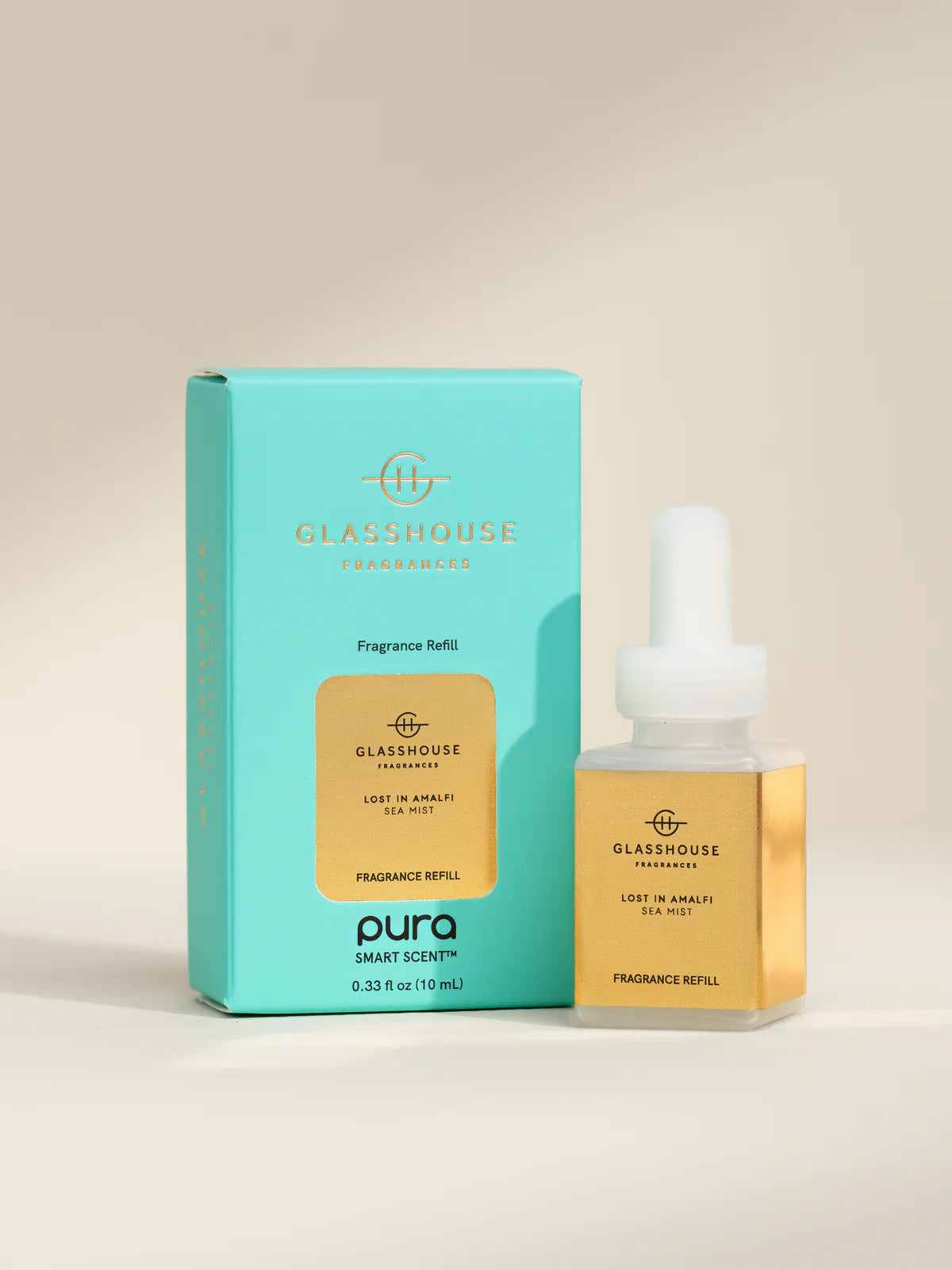 Glasshouse Fragrance Pura Refill bottle and packaging on a beige background