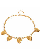 Gold necklace with heart-shaped charms on a white background