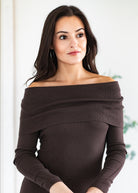 Woman wearing a brown off-shoulder sweater against a white background