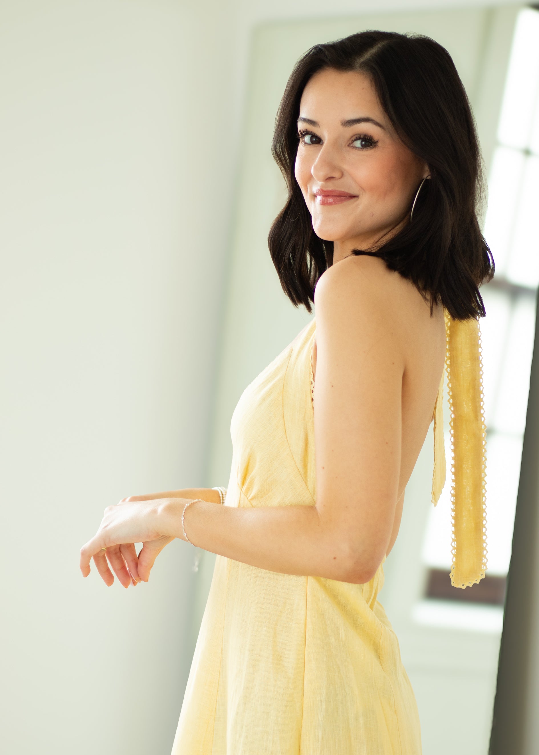 Woman in a yellow dress with a blurred background