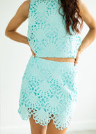 Light blue crochet dress on a white background