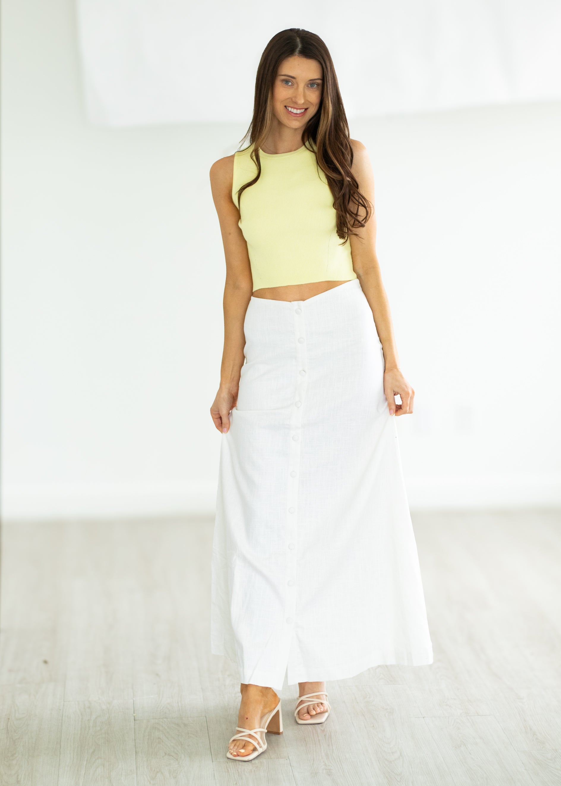 woman wearing yellow tank