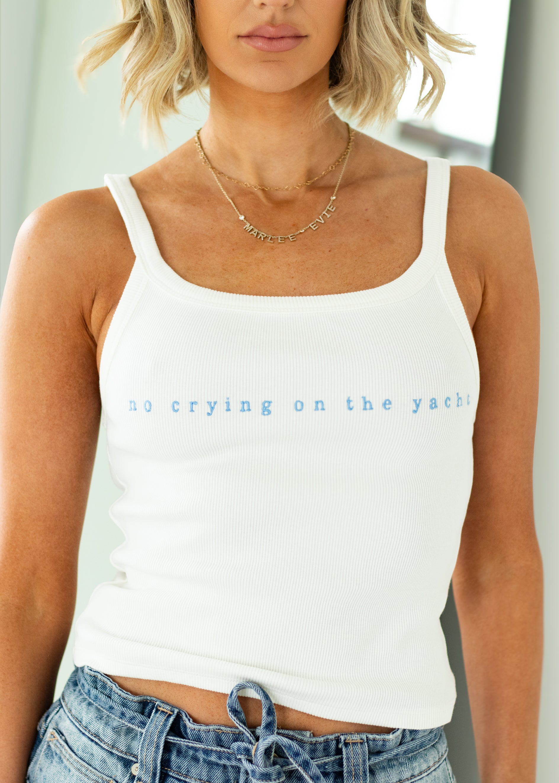 woman wearing white tank