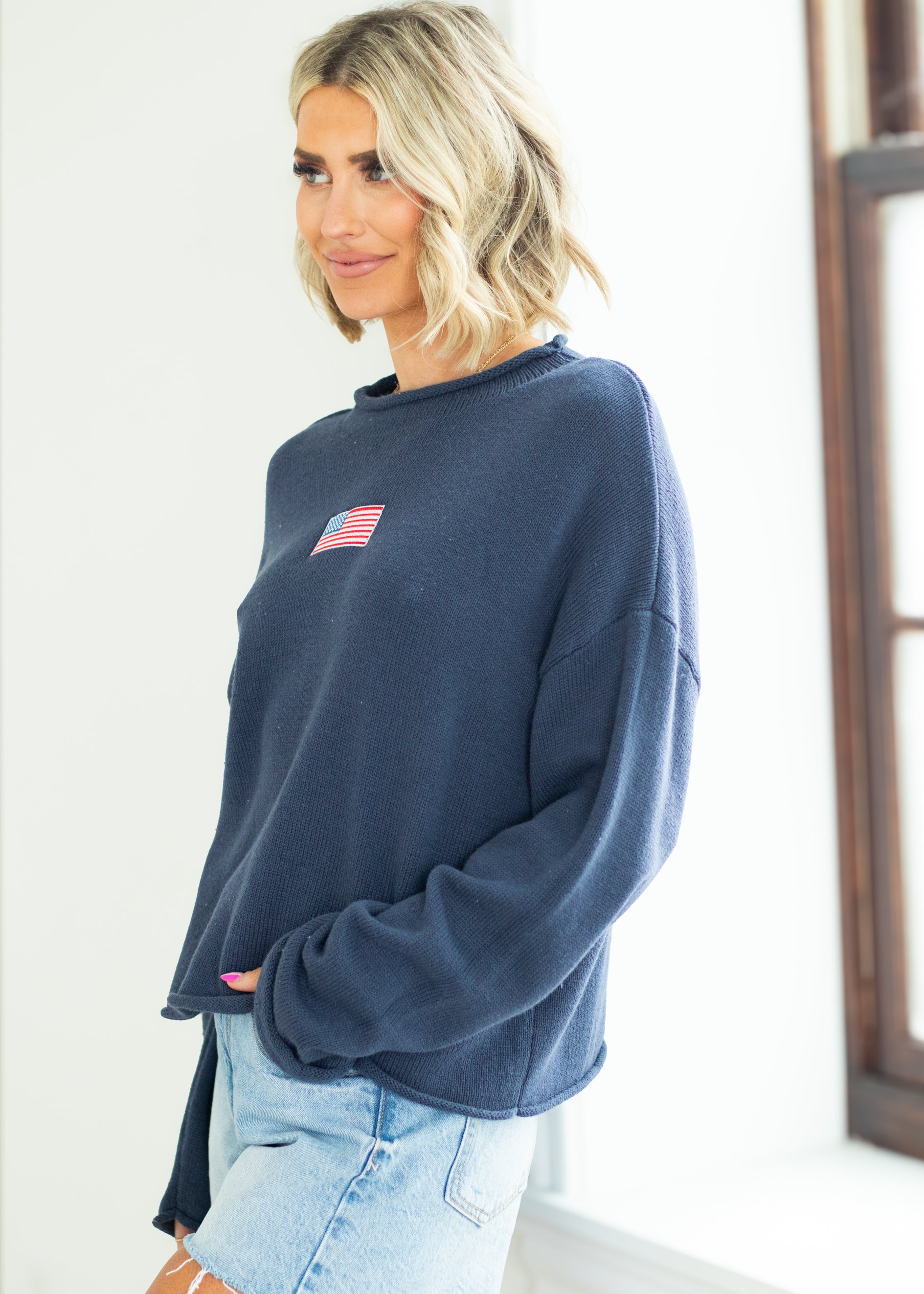 woman wearing navy sweater