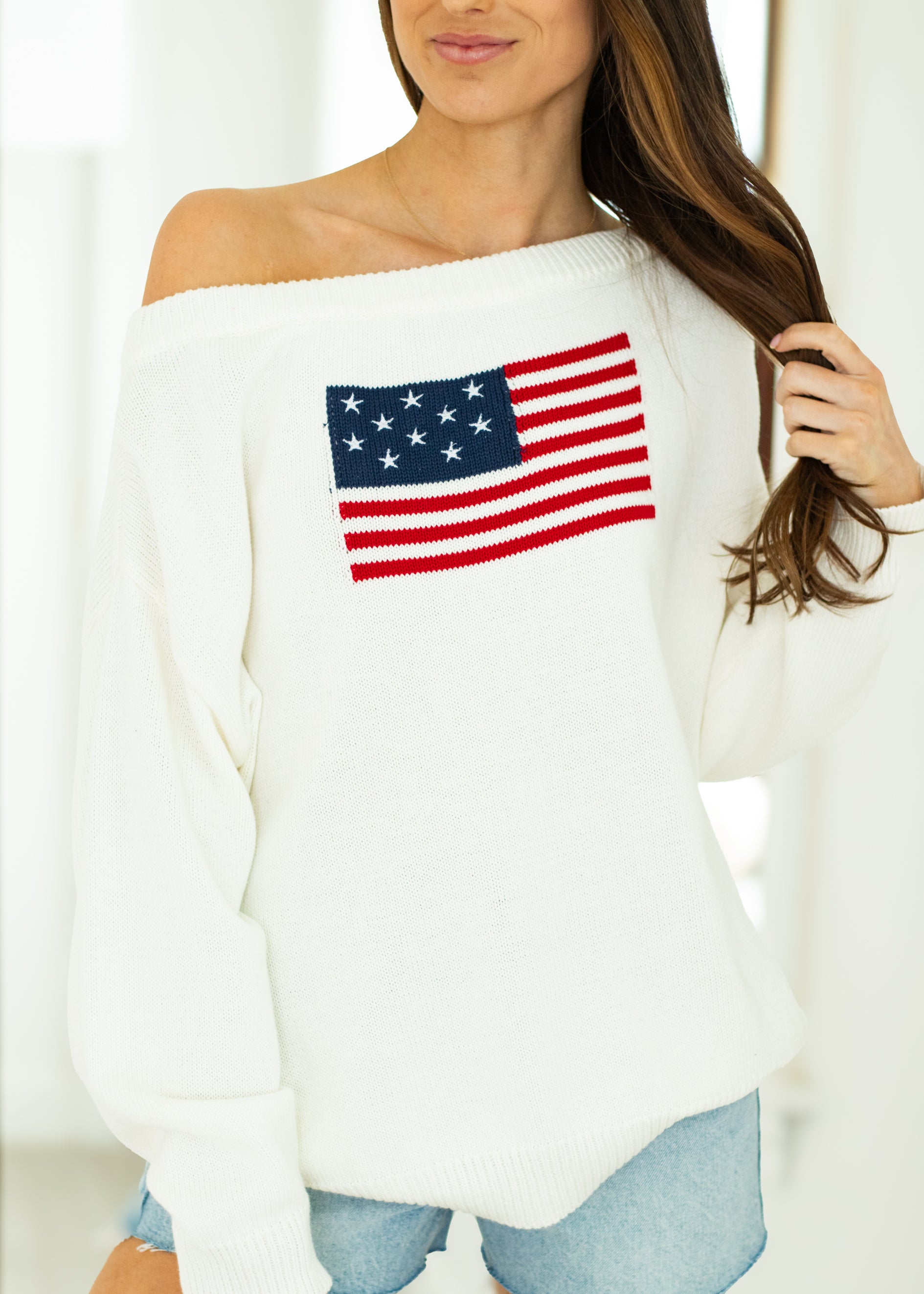 woman wearing white USA sweater