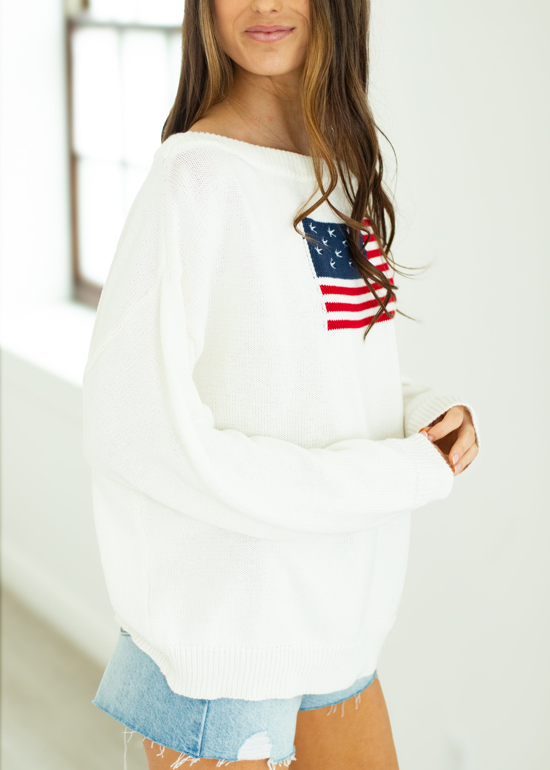 woman wearing white USA sweater