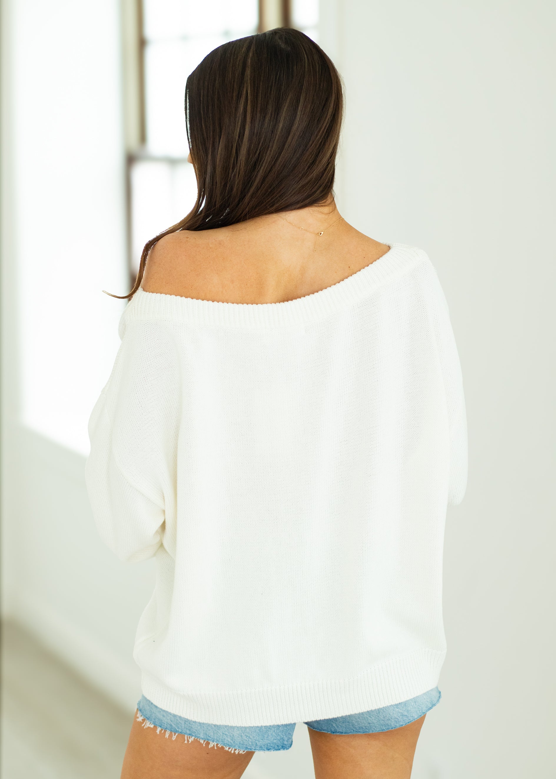 woman wearing white USA sweater
