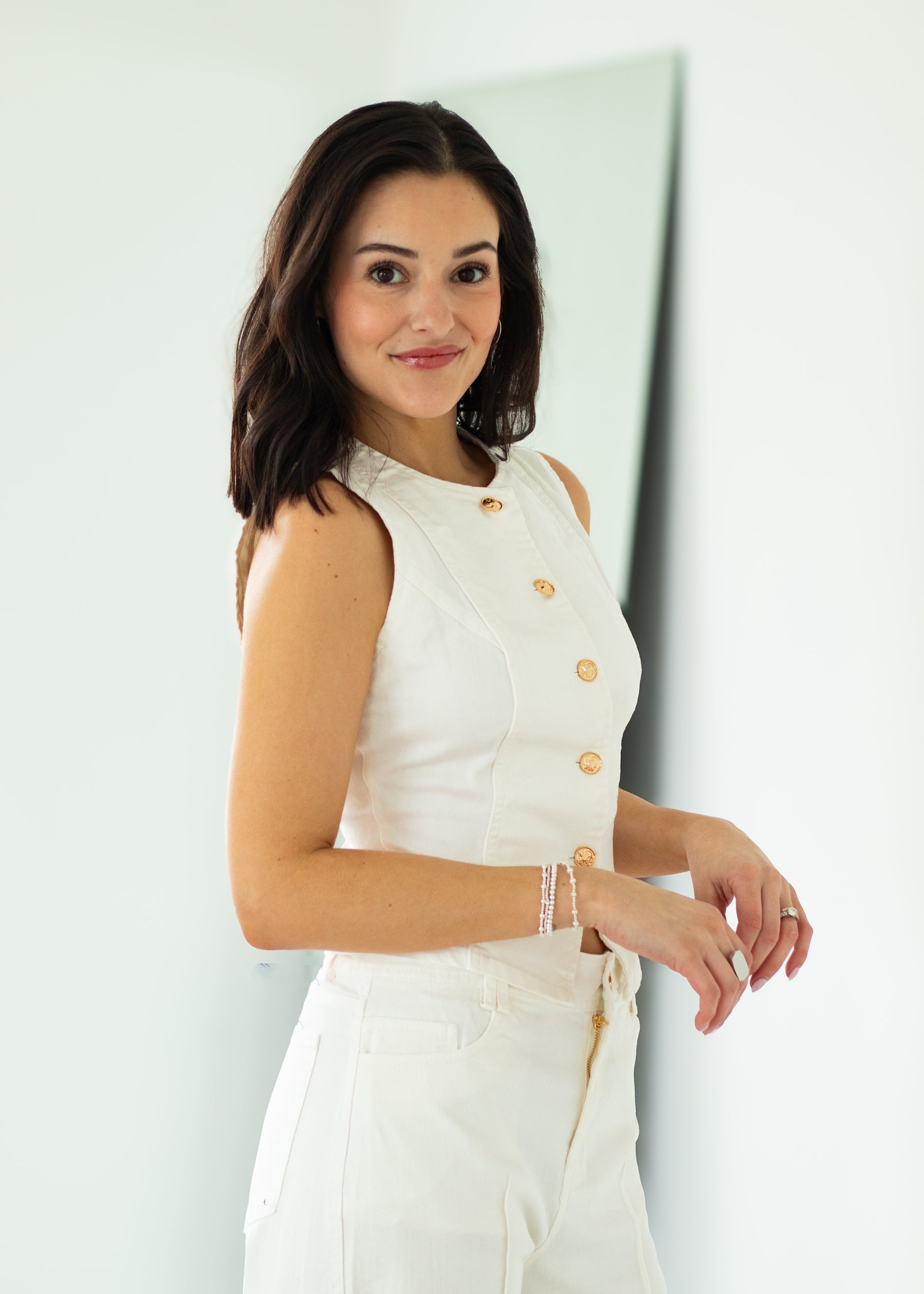 woman wearing white denim outfit