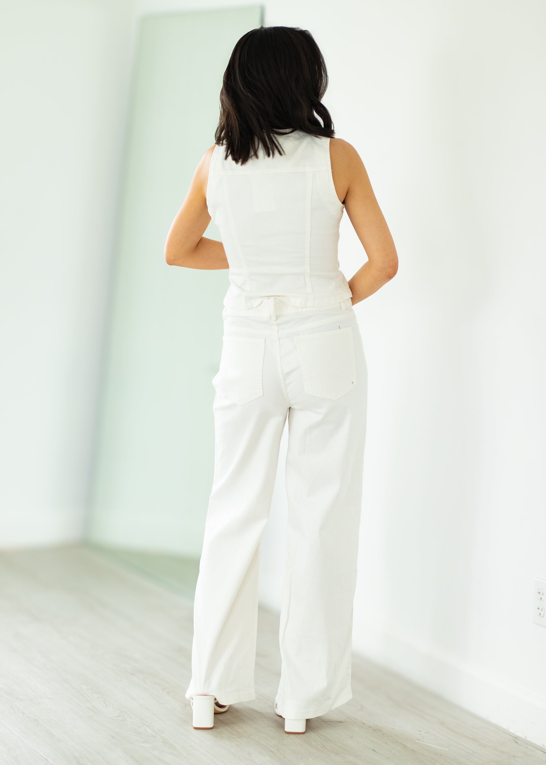 woman wearing white denim outfit