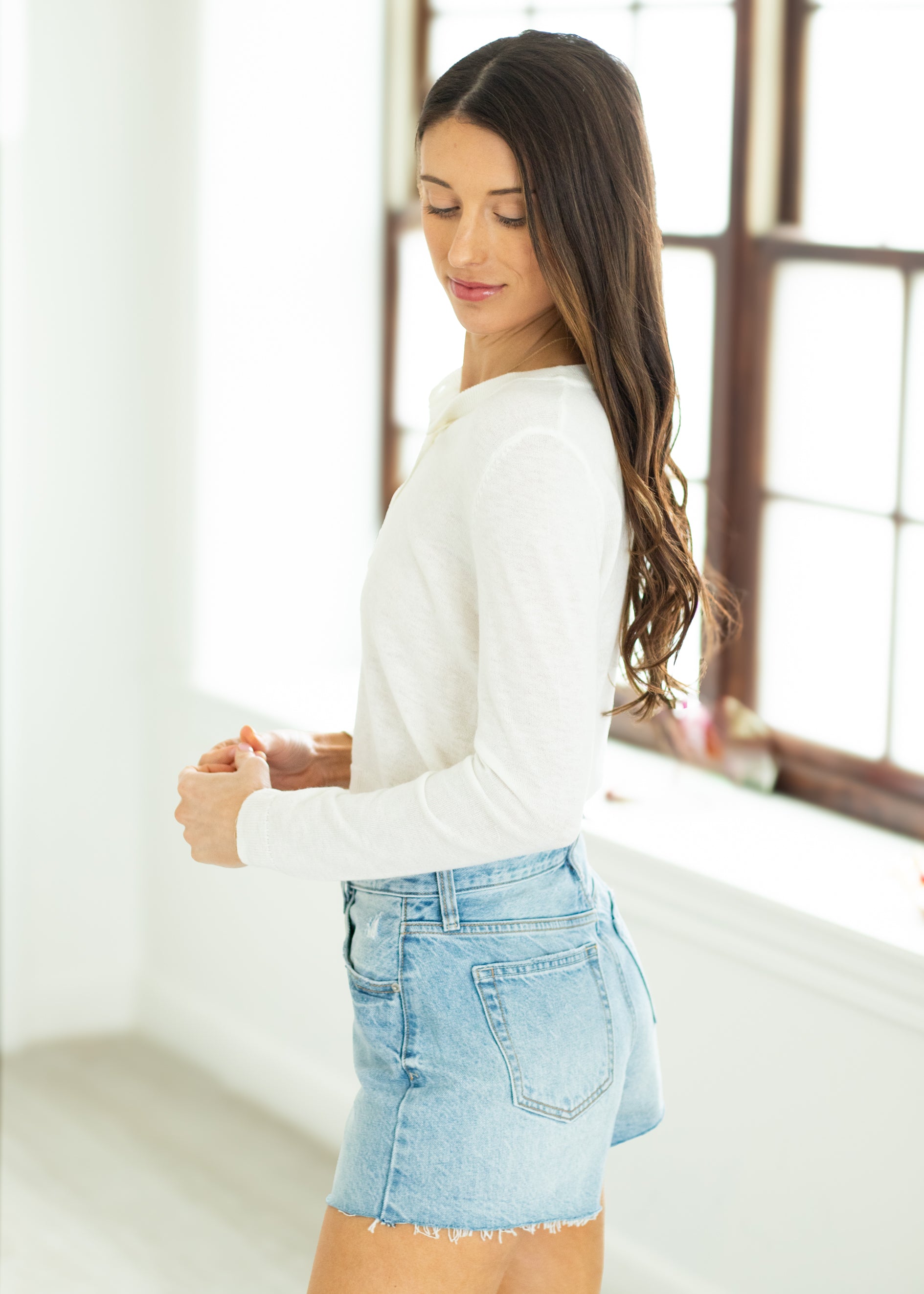 woman wearing white cardigan