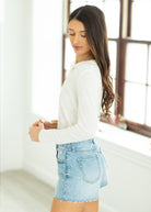 woman wearing white cardigan