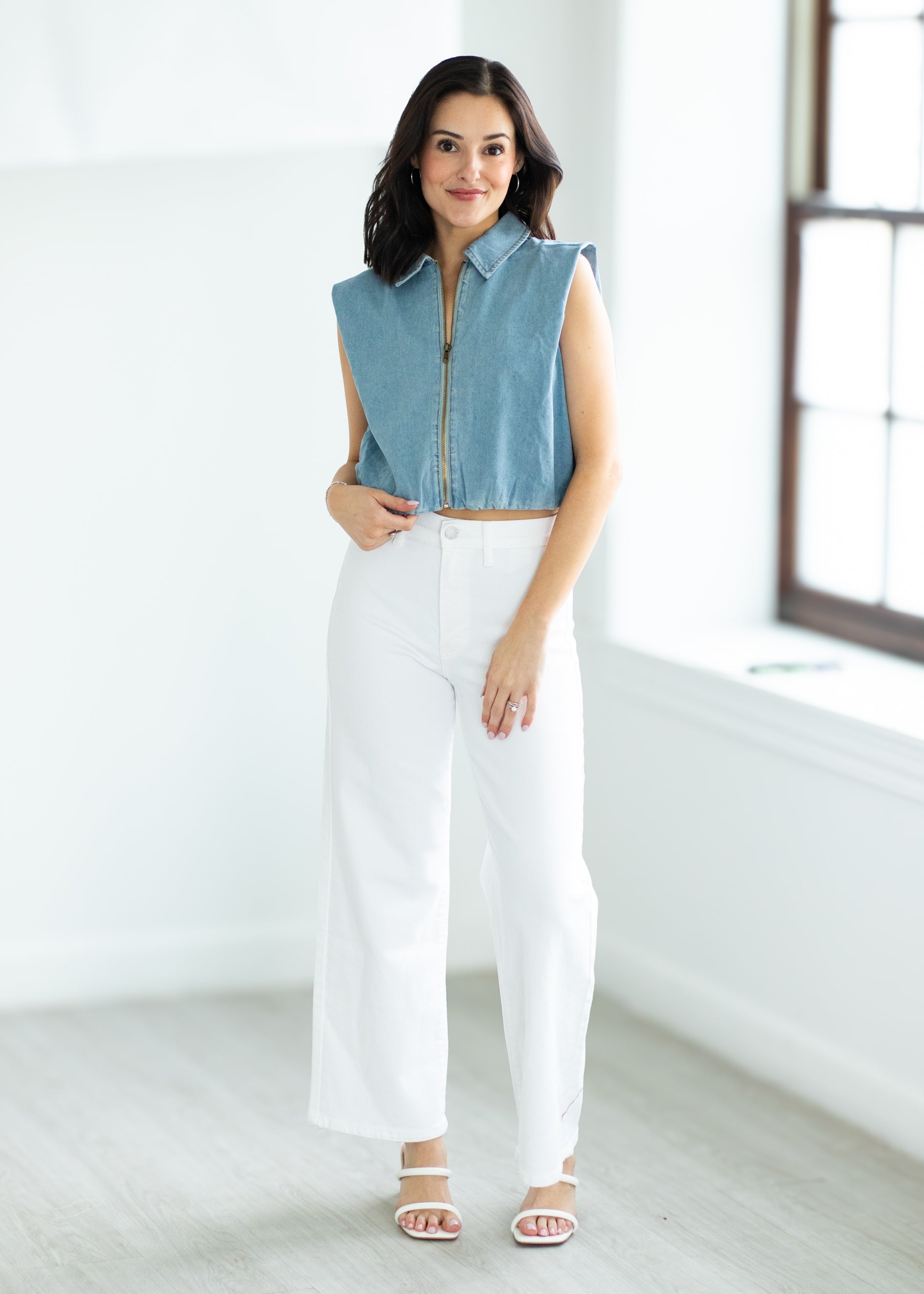 woman wearing a denim vest

