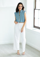 woman wearing a denim vest

