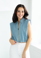 woman wearing a denim vest
