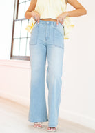 Light blue jeans worn by a person with a neutral background