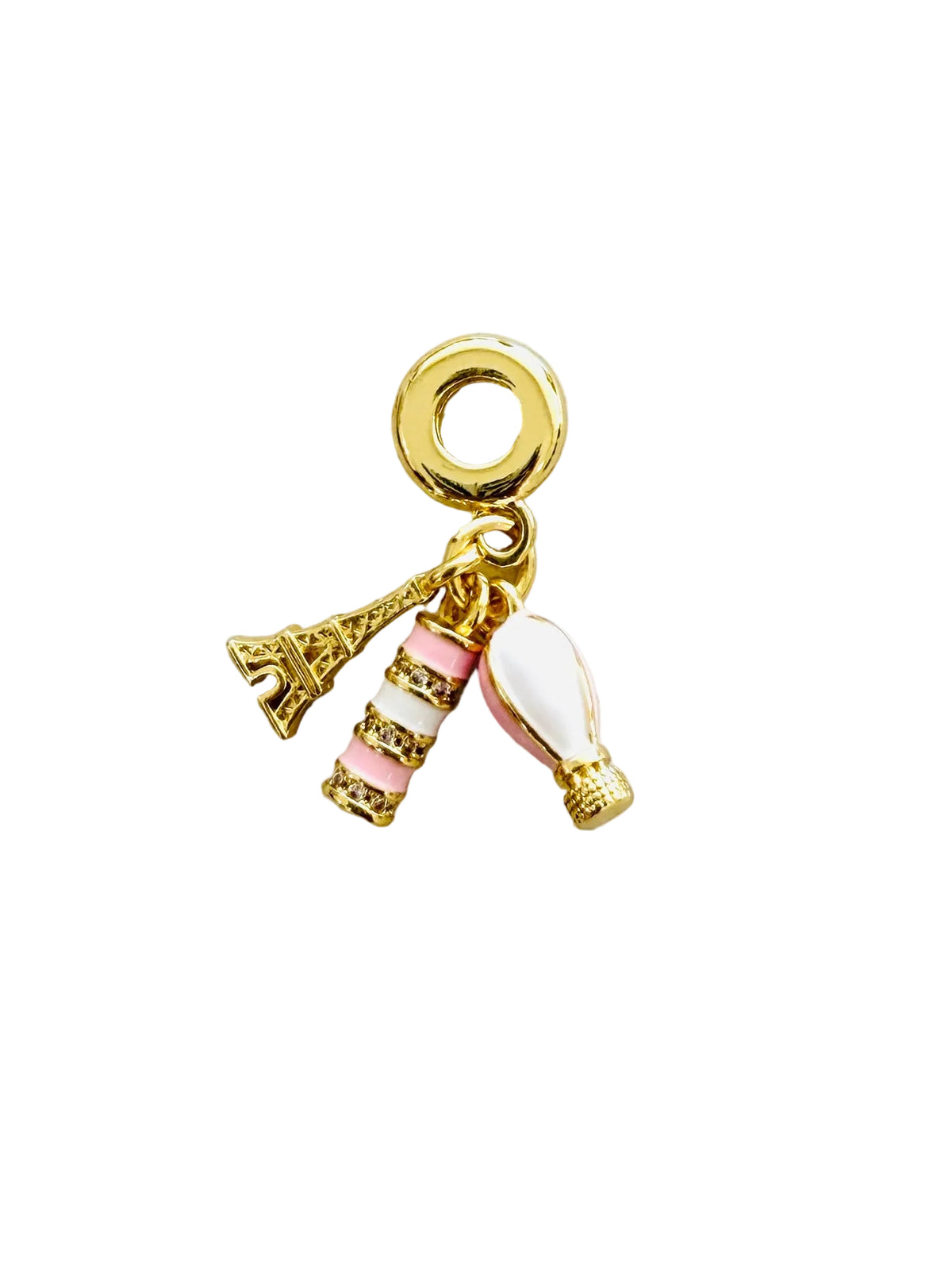 A gold-plated charm bead featuring three dangling charms: a miniature Eiffel Tower, a striped pink and white candle, and a white and pink hot air balloon, all attached to a gold ring.